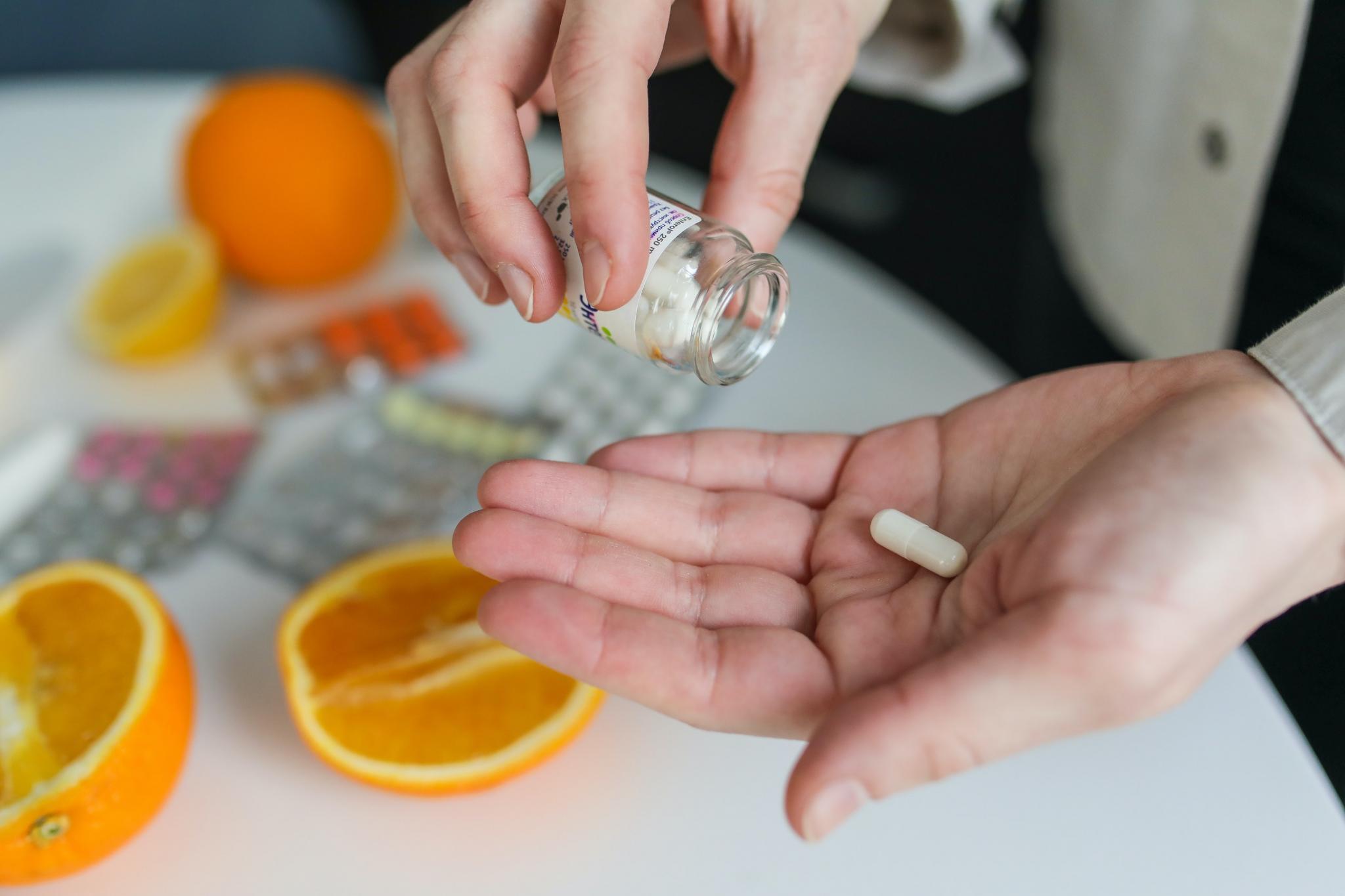 Picture of a pill and oranges